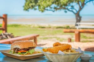 House made lunch at BarraCrab Caravan Park. Beachfront dining.